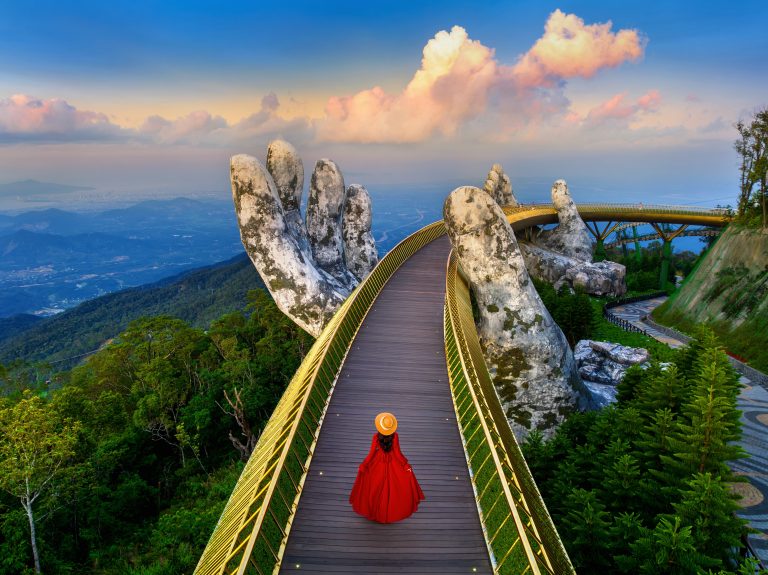 Tourist,Walking,At,Golden,Bridge,In,Danang,Vietnam.