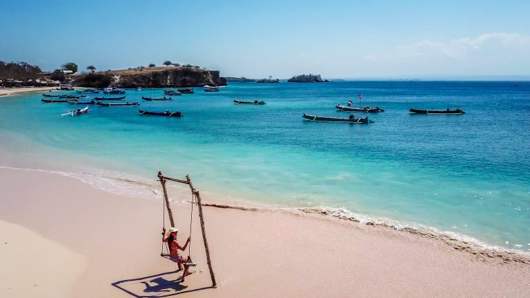 A,Girl,Swinging,On,A,Swing,Placed,On,The,Seashore