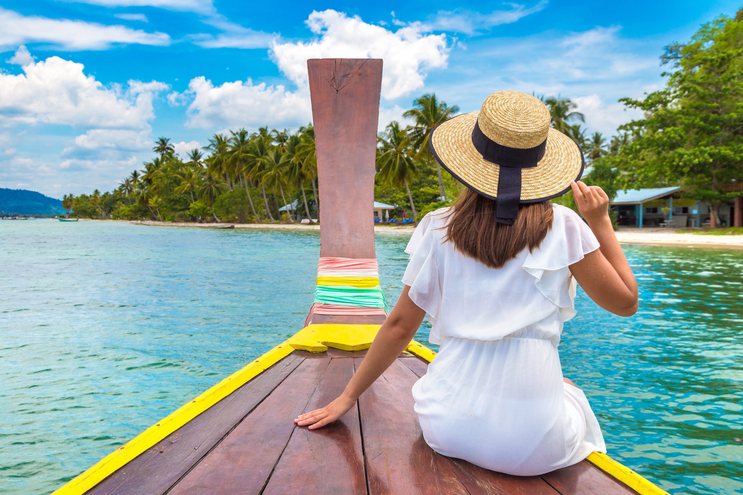 Happy,Traveler,Woman,Relaxing,On,Boat,Near,Tropical,Island