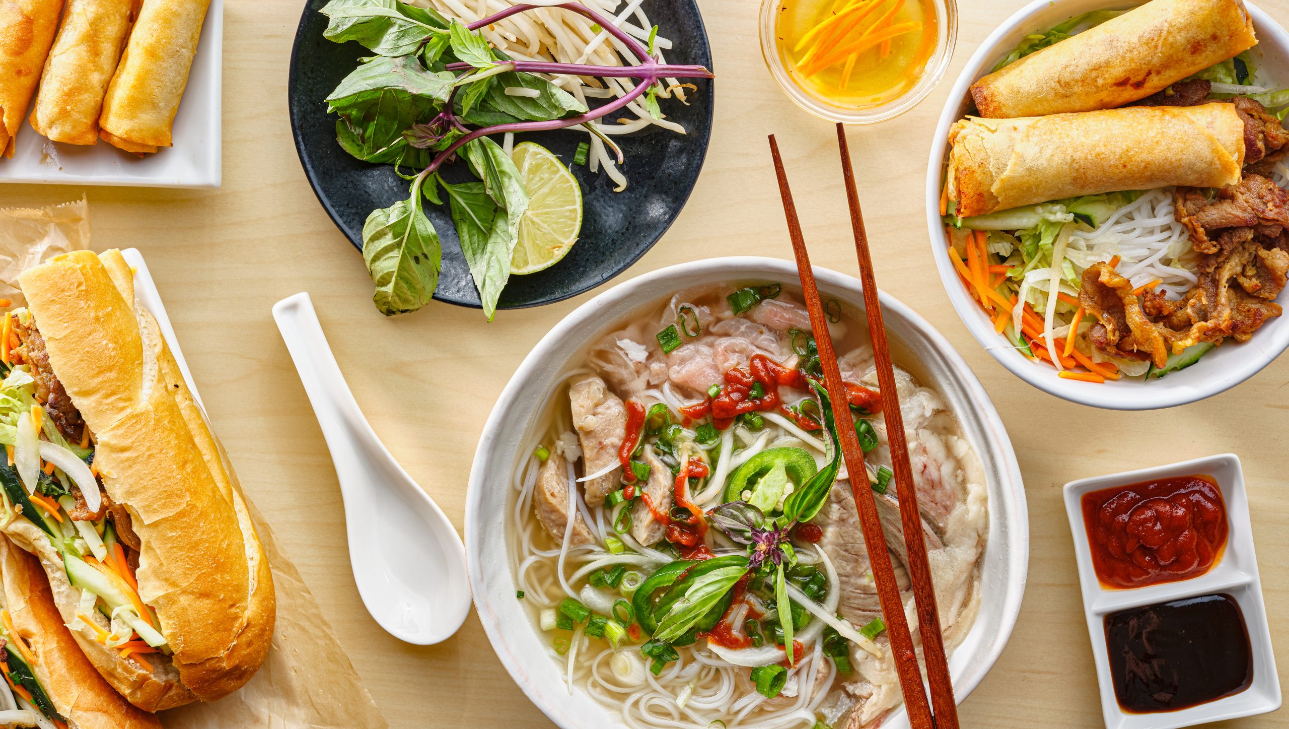 Assorted,Vietnamese,Dishes,With,Pho,,Bahn,Mi,,Spring,Rolls,In